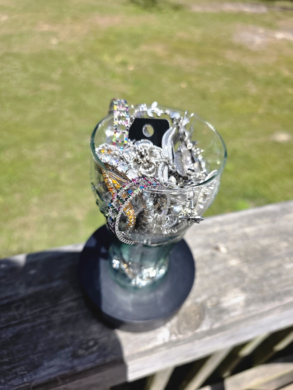 Decorative Glass Cup Filled with Silver and Multicolor Accent Jewelry